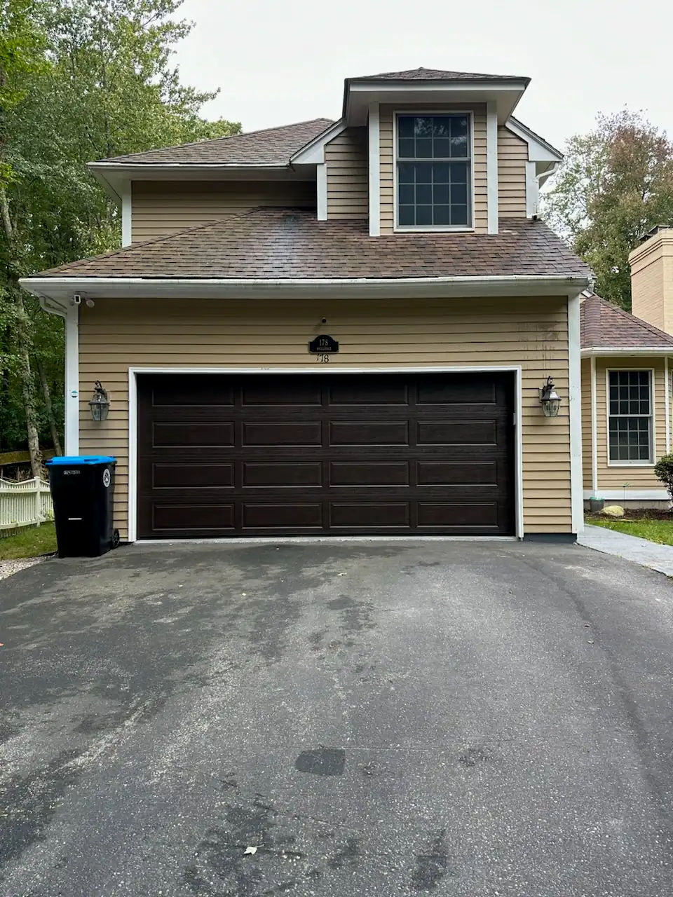 After: a dark brown door changes the whole front of the house