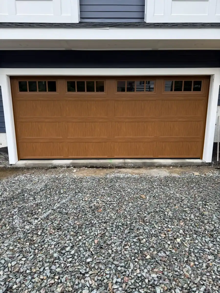 A brown carriage-style double door