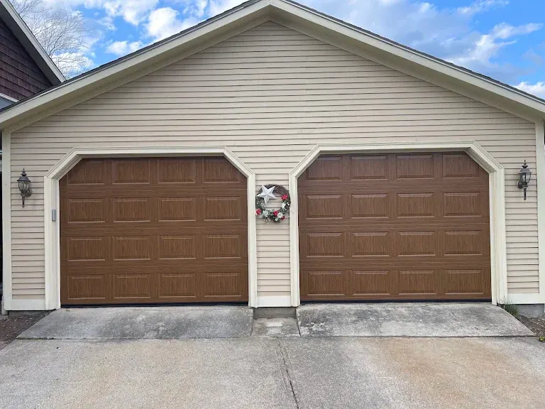 Two brown wood-tone doors with a center entry door