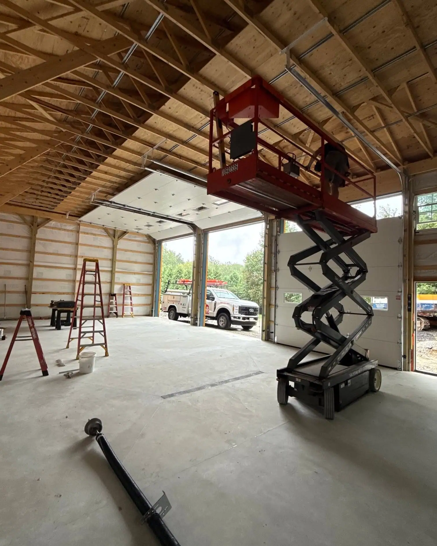 Installing tall commercial doors from a lift inside a new building
