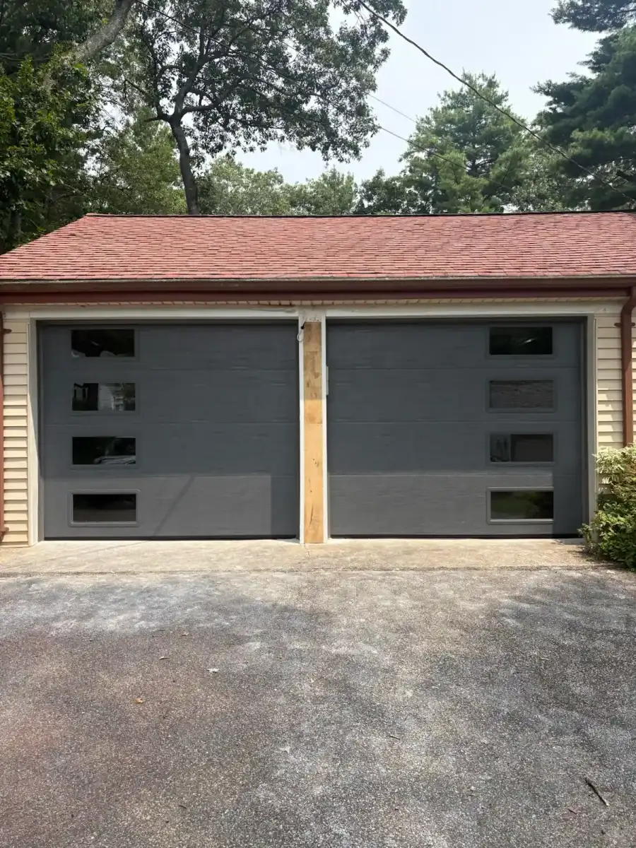 Two flush-panel gray doors on a new build